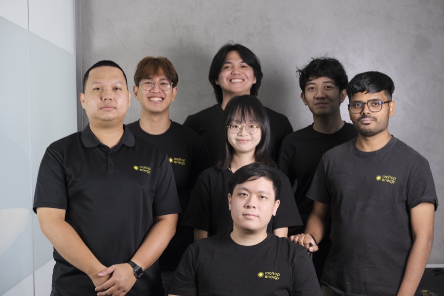 The Rooftop Energy team together in branded shirts.